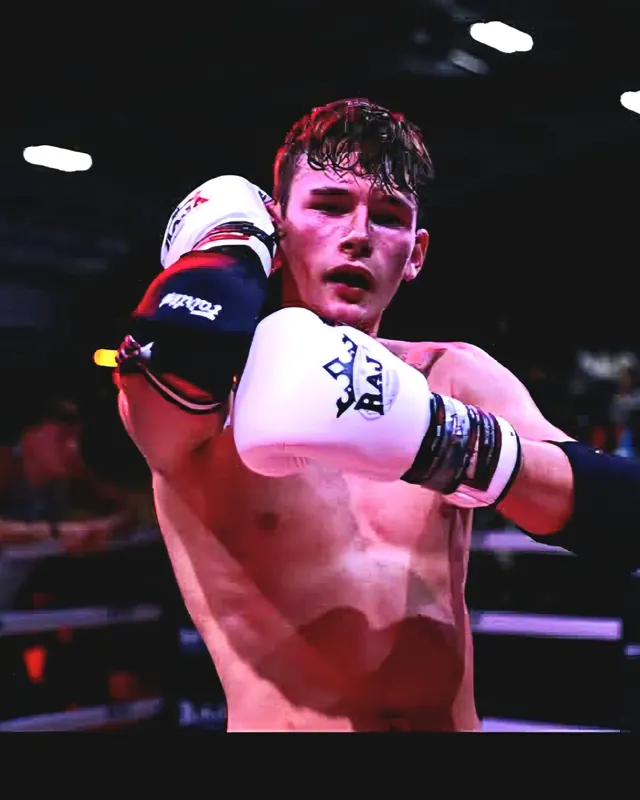 Pride Gym Muay Thai fighter holding a high guard in the ring