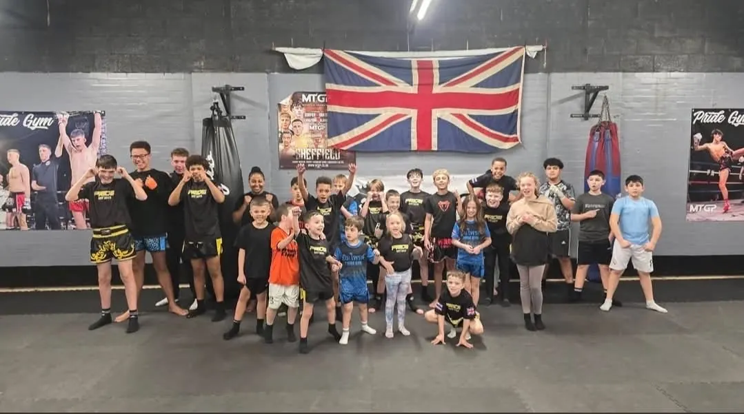 Pride Gym Sheffield junior members celebrating together in the gym